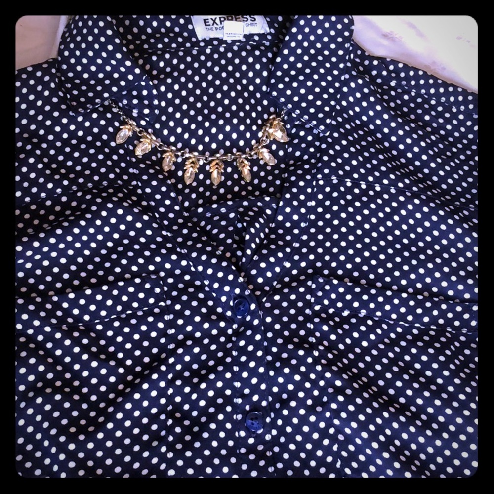 long sleeved  Polka dotted v-neck buttoned shirt.